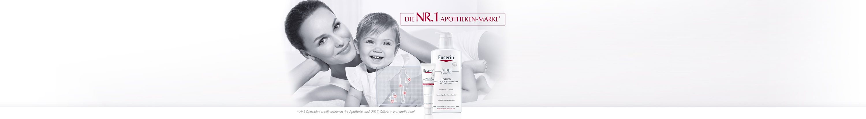 Frau mit Kind im Arm